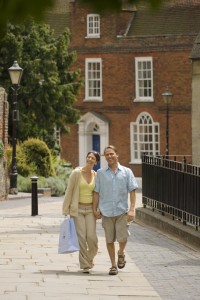 Couple walking hand in hand through St Albans, St Albans, Hertfordshire, England.